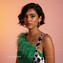 Stylish Woman Wearing Green Feather Accessory and Cow Print Dress