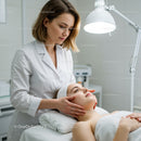 Woman Receiving Facial Massage in Beauty Clinic for Rejuvenation