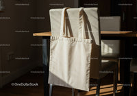 Minimalist canvas tote bag hanging on dining chair