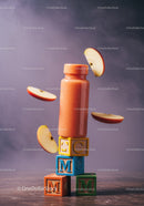 Fresh apple smoothie with floating apple slices on blocks