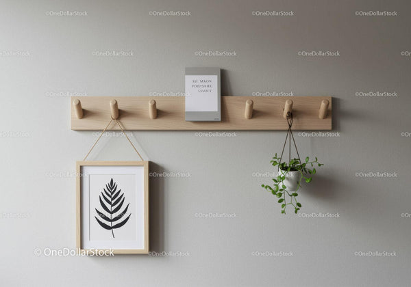 Minimalist Wooden Coat Rack with Hanging Plant and Framed Art