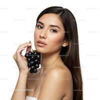 Elegant Woman Holding Black Grapes for Healthy Lifestyle Portrait