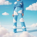 Cloud-Inspired Fashion with Fluffy Cloud Accessories in Blue Sky Setting