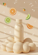 Minimalist bottle with citrus elements on textured surface