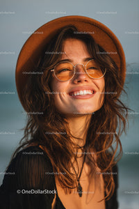 Happy Young Woman Wearing Brown Hat and Sunglasses Outdoors