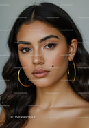 Portrait of a Young Woman with Brown Eyes and Gold Earrings