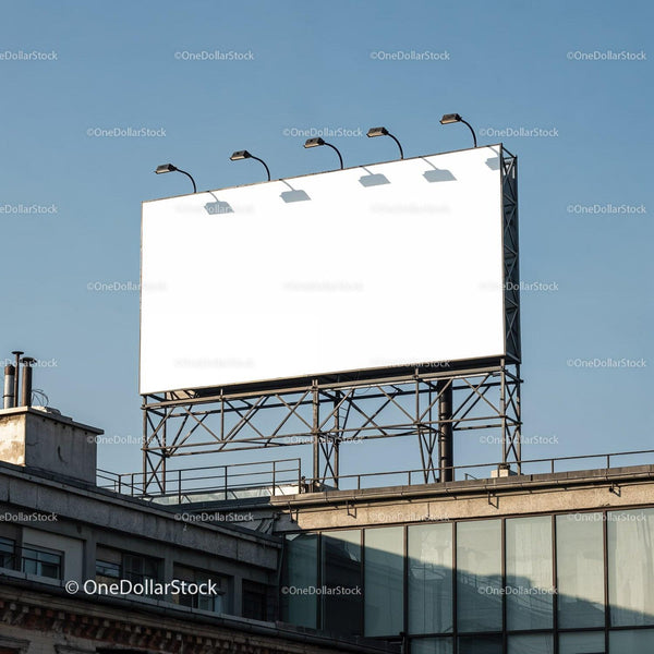 Blank billboard on rooftop against clear blue sky JPG Mockup Image