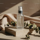 Elegant Skincare Spray with Eucalyptus Leaves on Soft Fabrics