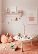 Cute Pink and White Kids Room with Plush Toys and Wall Art