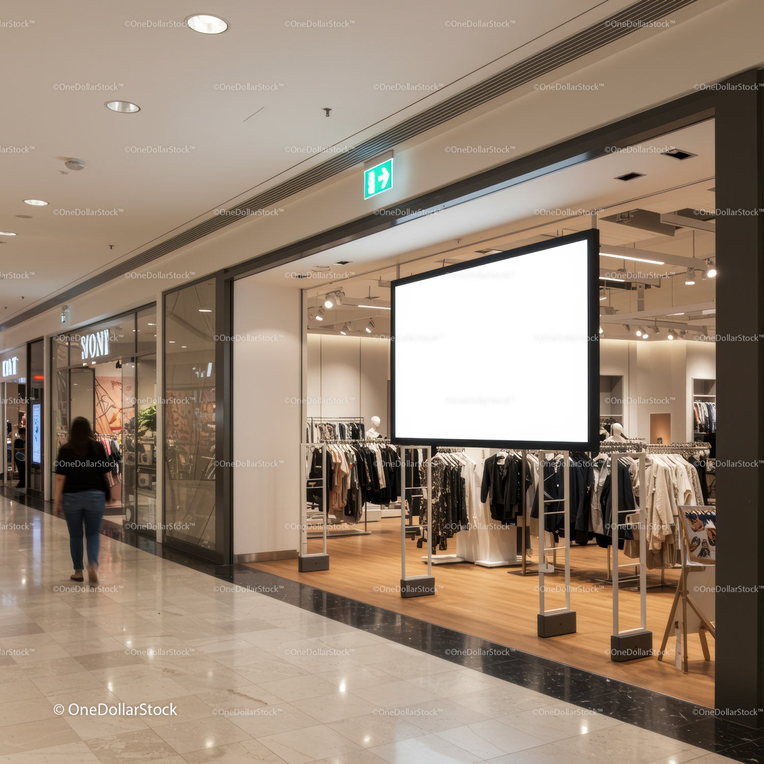 Empty clothing store display with illuminated ad board