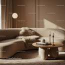 Cozy modern living room with curved sofa and soft textiles