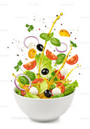 Fresh mixed salad with olive oil splash in white bowl