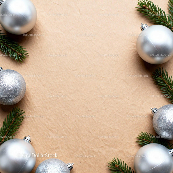 Silver Christmas baubles with fir branches on kraft paper