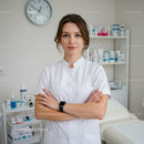 Dedicated Female Doctor Standing Confidently in Modern Medical Clinic