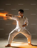 Martial artist practicing a focused punch in traditional attire