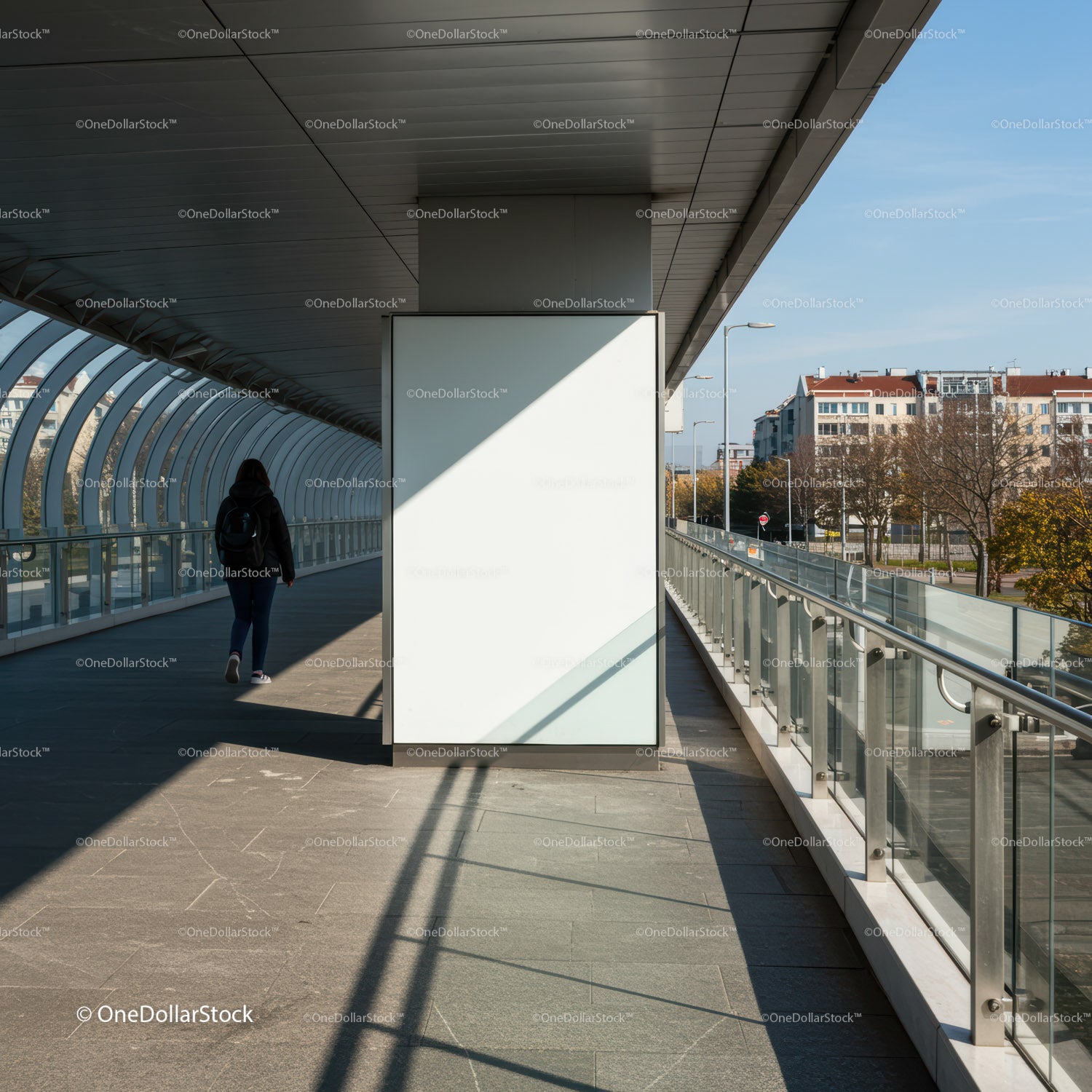 Person walking through modern covered urban walkway