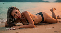 Elegant Woman in Black Bikini Lying on Beach at Sunset