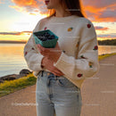 Woman Holding Fresh Blueberries at Lakeside Sunset