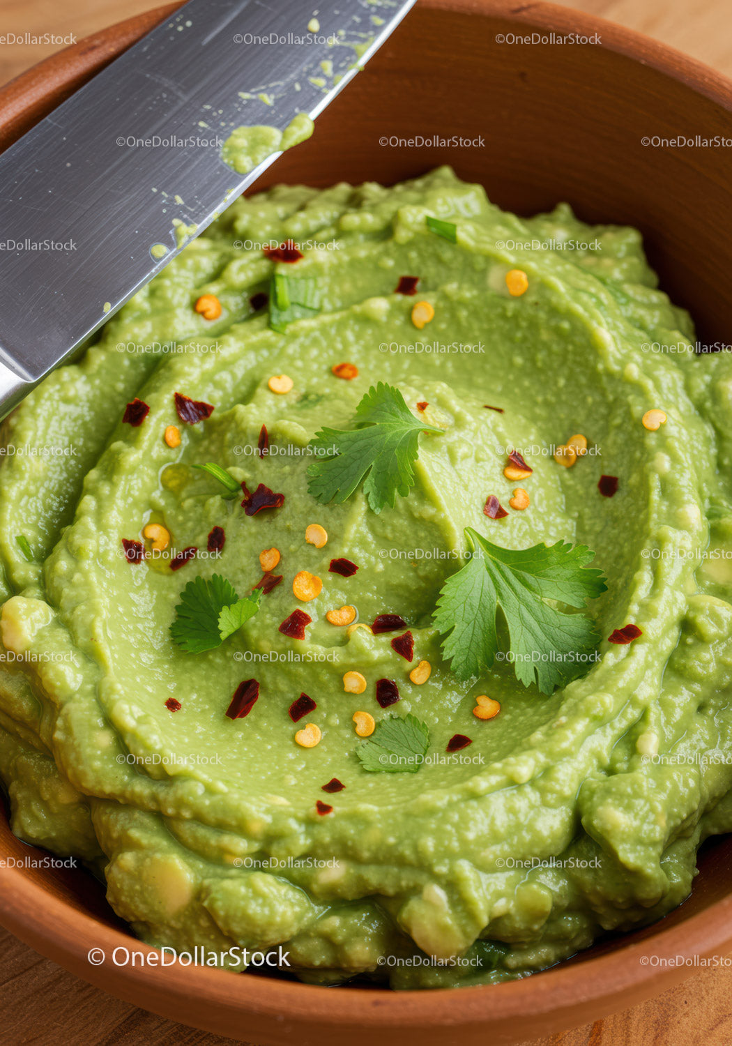 Fresh Guacamole with Chili Flakes and Cilantro Garnish