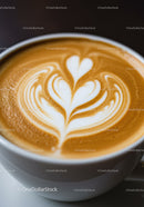 Closeup of latte art with leaf and heart design