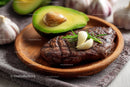 Grilled Steak with Avocado Garlic and Rosemary on Wooden Plate
