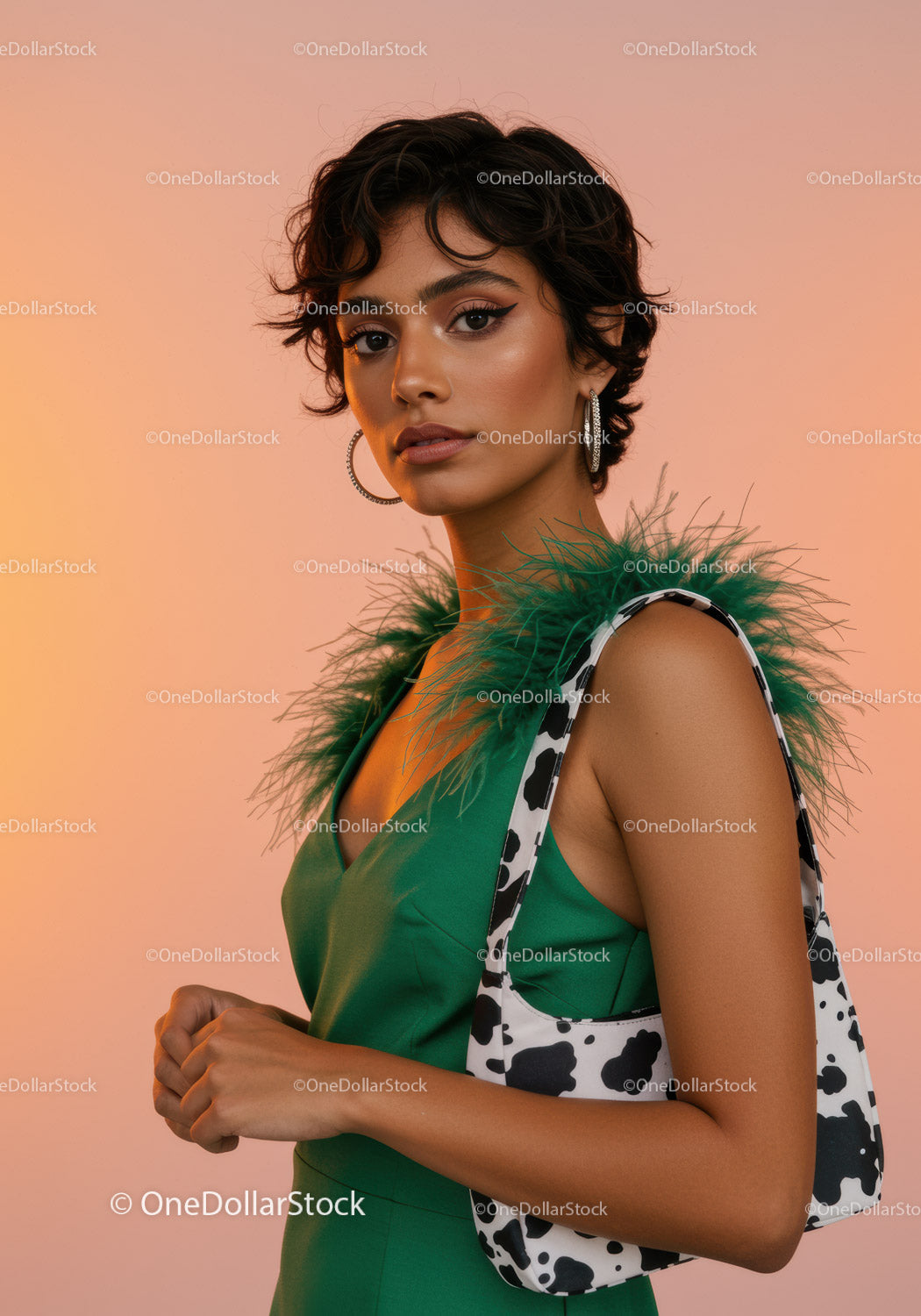 Elegant Woman in Green Dress with Feathered Accessory and Cowl Hair