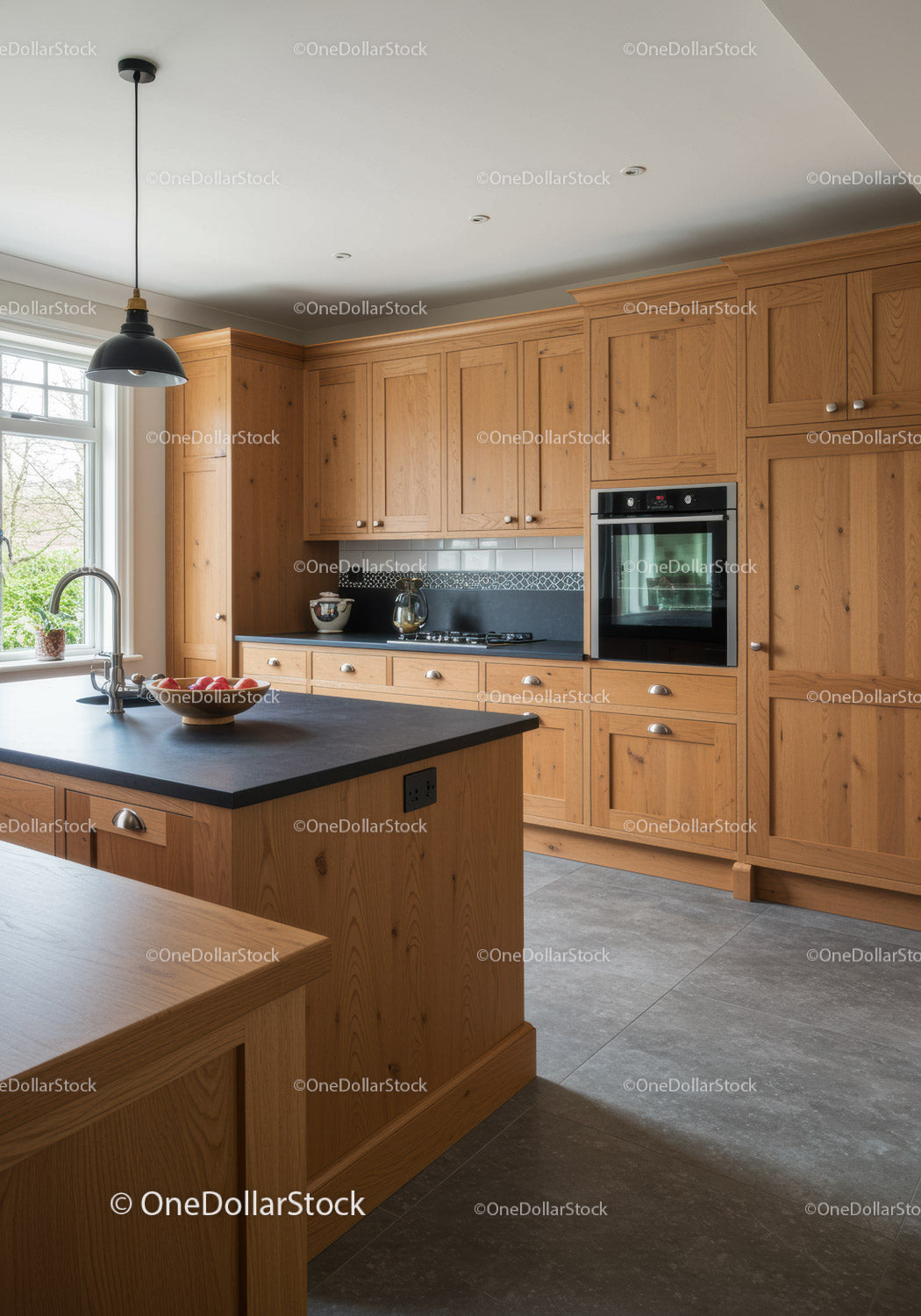 Modern kitchen with wooden cabinets and black countertops