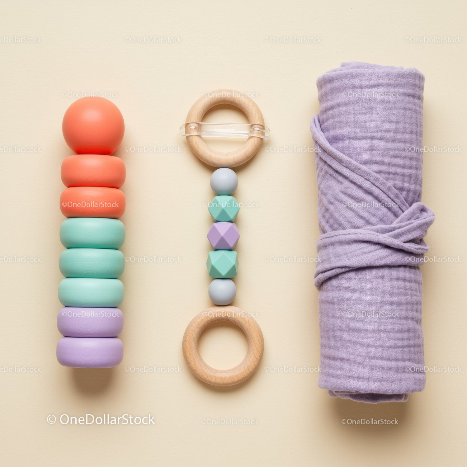 Colorful wooden baby toys and soft purple blanket