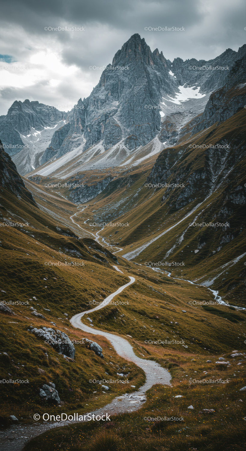Majestic Rocky Mountain Peaks with Winding Trail in Scenic Valley