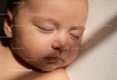 Peaceful sleeping baby in soft natural light