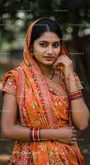Elegant Indian Woman in Vibrant Sari with Jewelry in Outdoor Setting