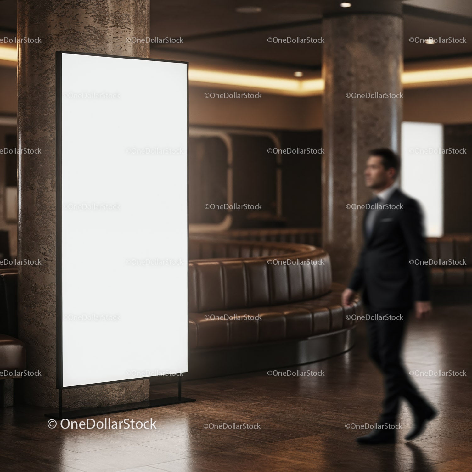 Blurred businessman walking past blank digital billboard indoors