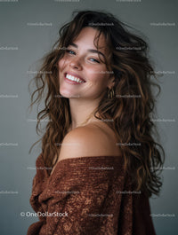 Joyful Smiling Woman with Curly Hair in Studio Portrait