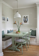 Bright Casual Dining Nook with Green Table and Tropical Flower Decor