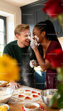 Couple Playfully Baking Heart Shaped Cookies Together