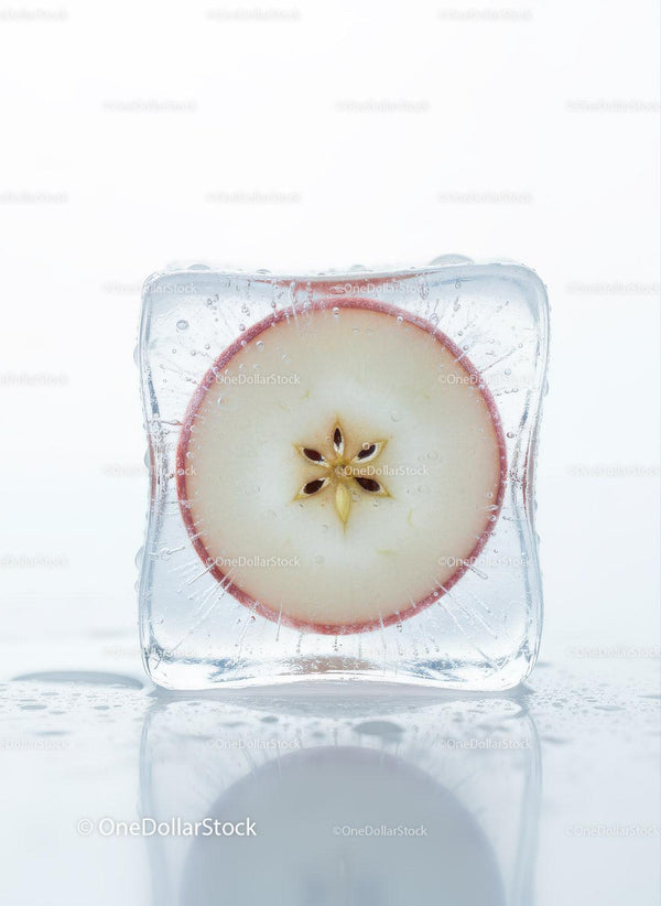 Apple Slice Frozen Inside a Clear Ice Cube Closeup