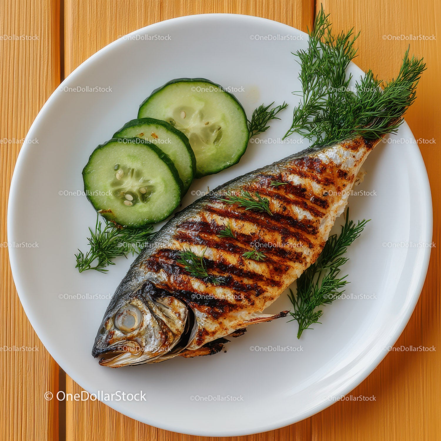 Grilled Whole Fish with Fresh Cucumber Slices and Dill Garnish