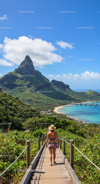 Tropical Mountain Landscape with Woman Walking on Wooden Pathway