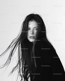 Monochrome Portrait of a Woman with Wet Hair and Intense Expression