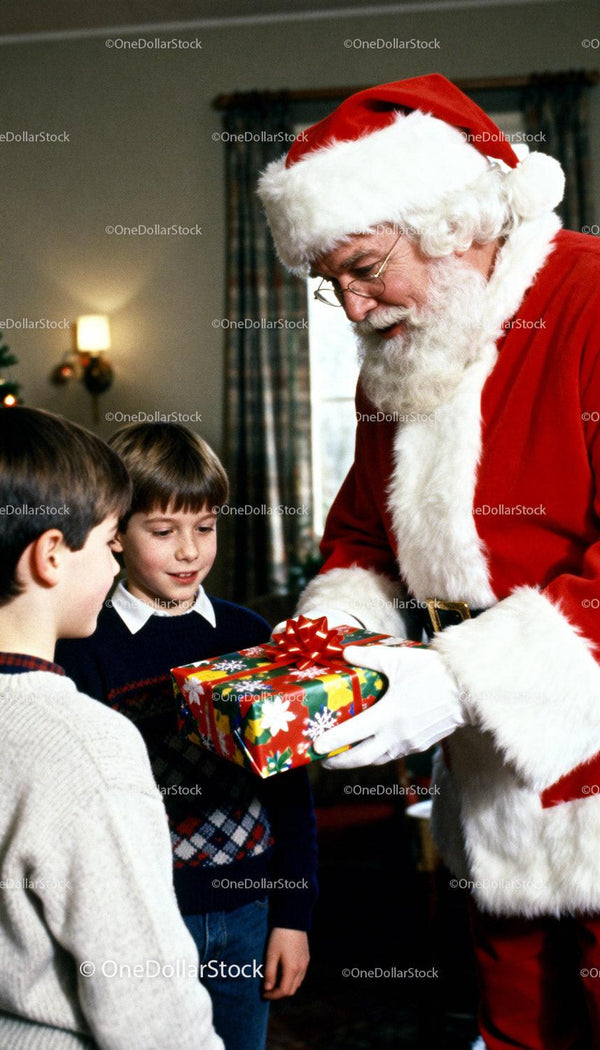 Santa Claus Giving Gift to Two Excited Boys Indoors