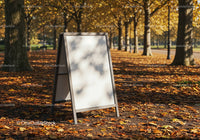Blank signboard on leafy path in autumn park