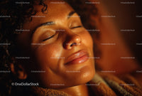 Close-up of Woman with Glowing Skin Relaxing in Warm Light