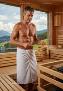 Male Man Relaxing in Wooden Sauna with Mountain View