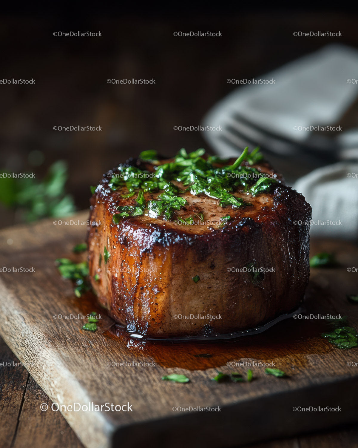 Juicy Grilled Steak with Herb Garnish on Rustic Wooden Board