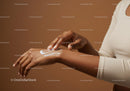 Close-up of Woman Applying Lotion to Hand for Skincare Routine