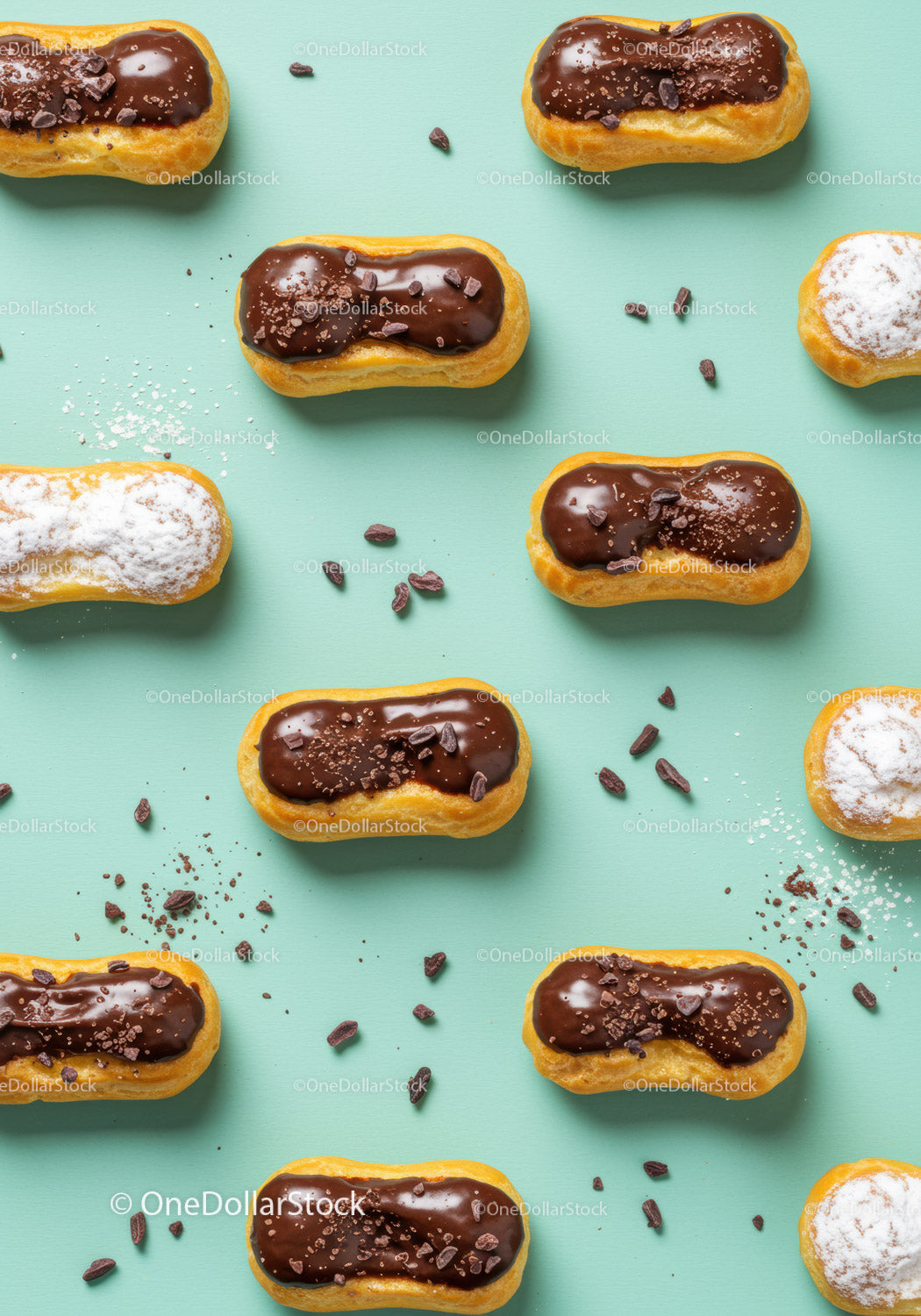 Mini eclairs with chocolate and powdered sugar topping