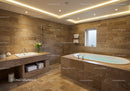 Modern Spa Bathroom with Beige Stone Tiles and Relaxing Bathtub