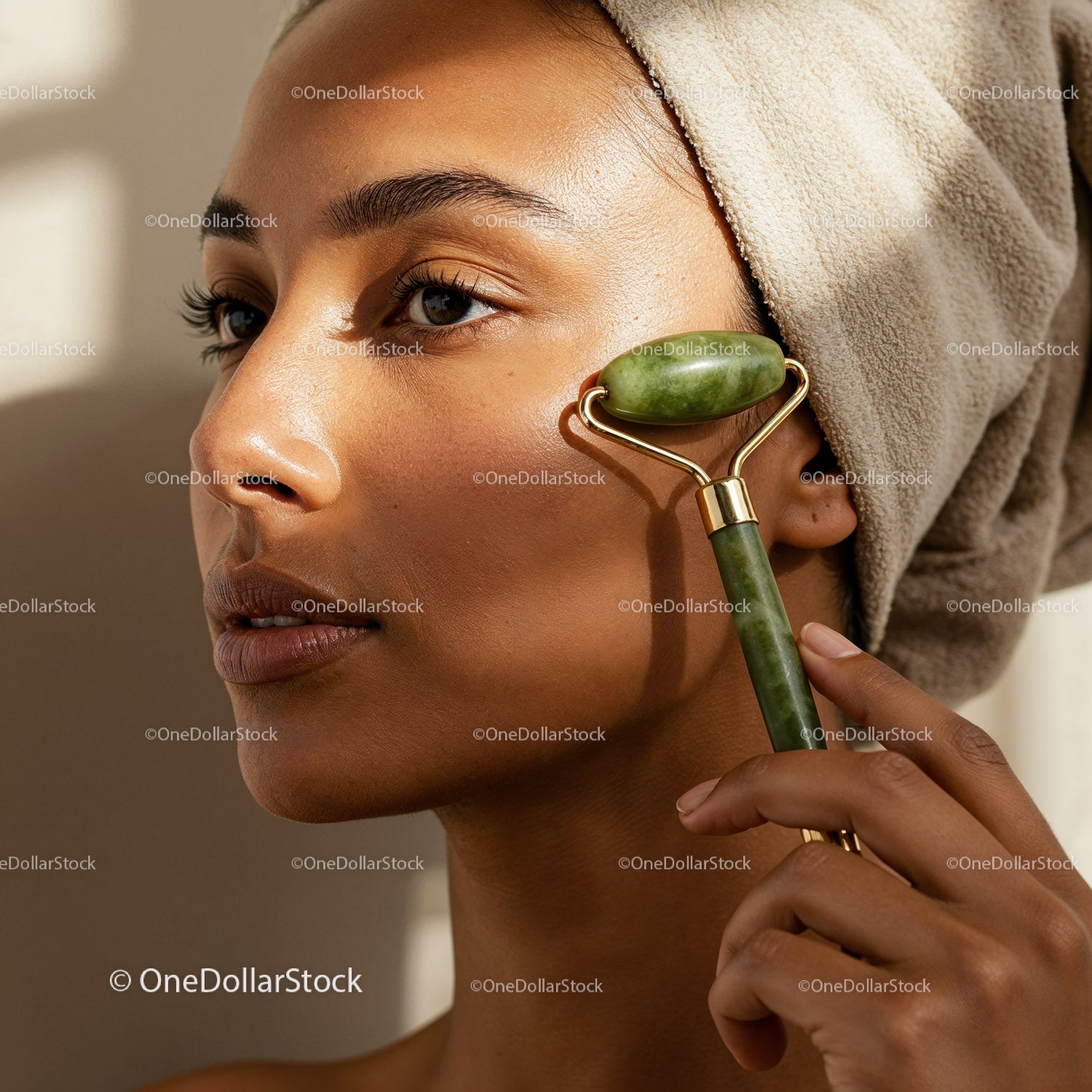 Woman Using Jade Roller for Facial Skincare Therapy