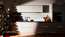 Modern kitchen with festive Christmas tree decoration
