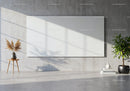Minimalist interior with blank canvas and natural plants